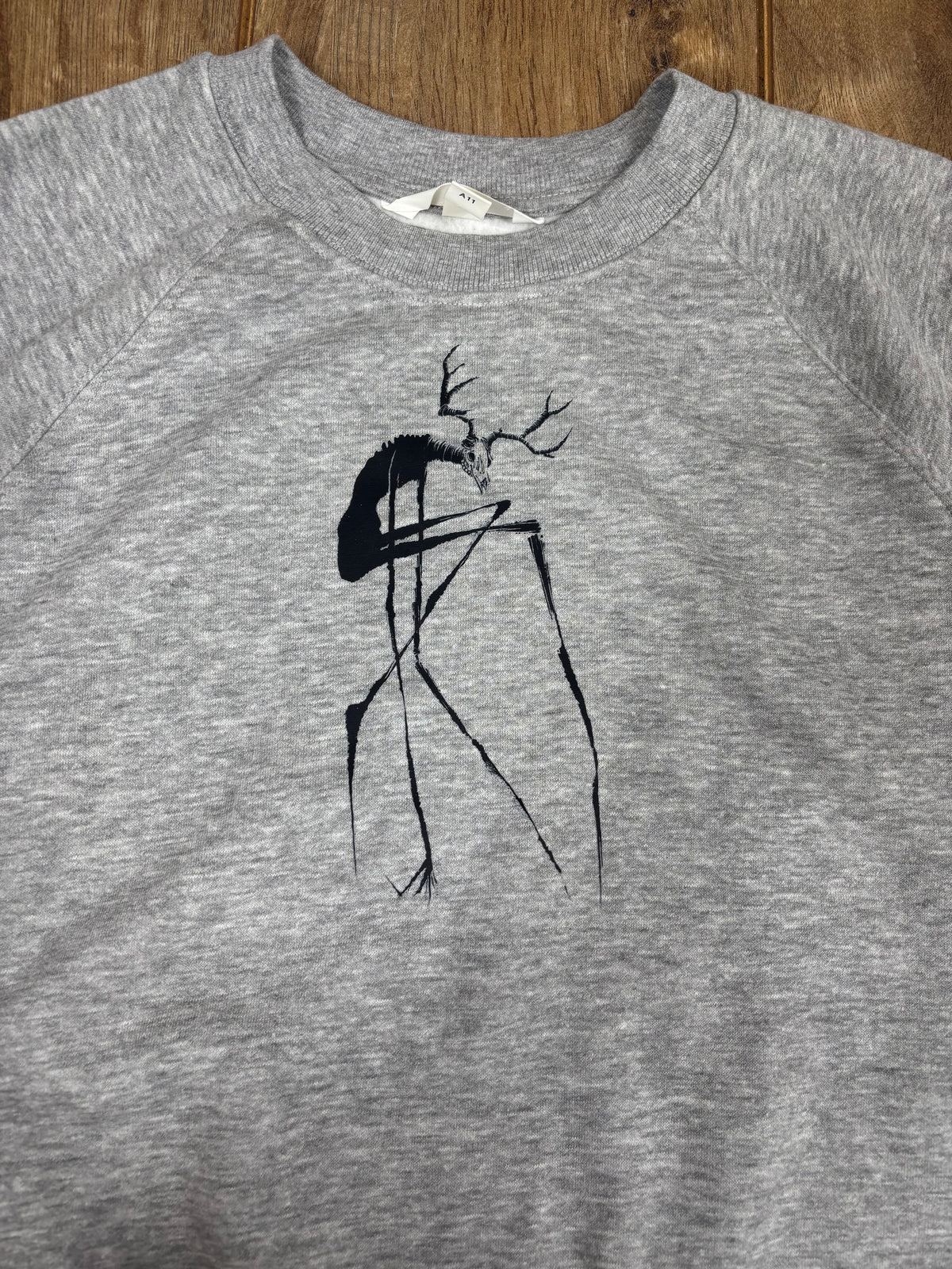 Upcycled gray jumper wendigo cryptid horror