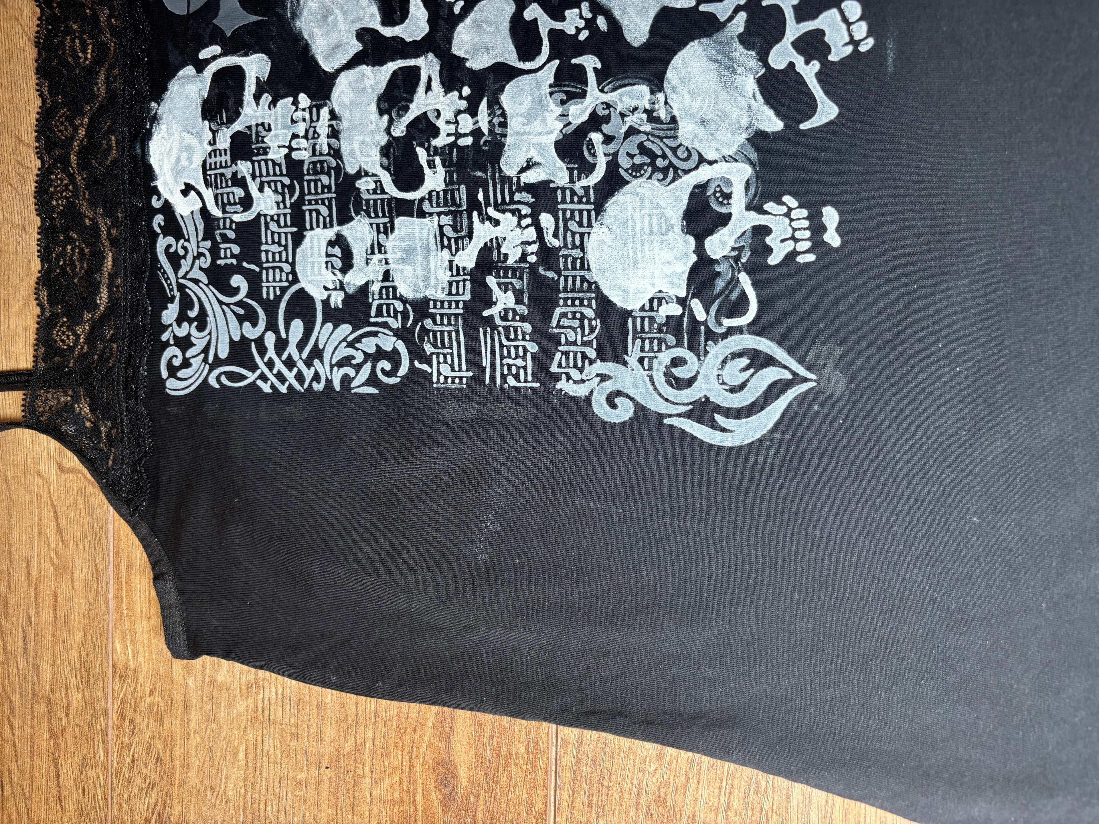 Laced black lady’s tank top with skull print