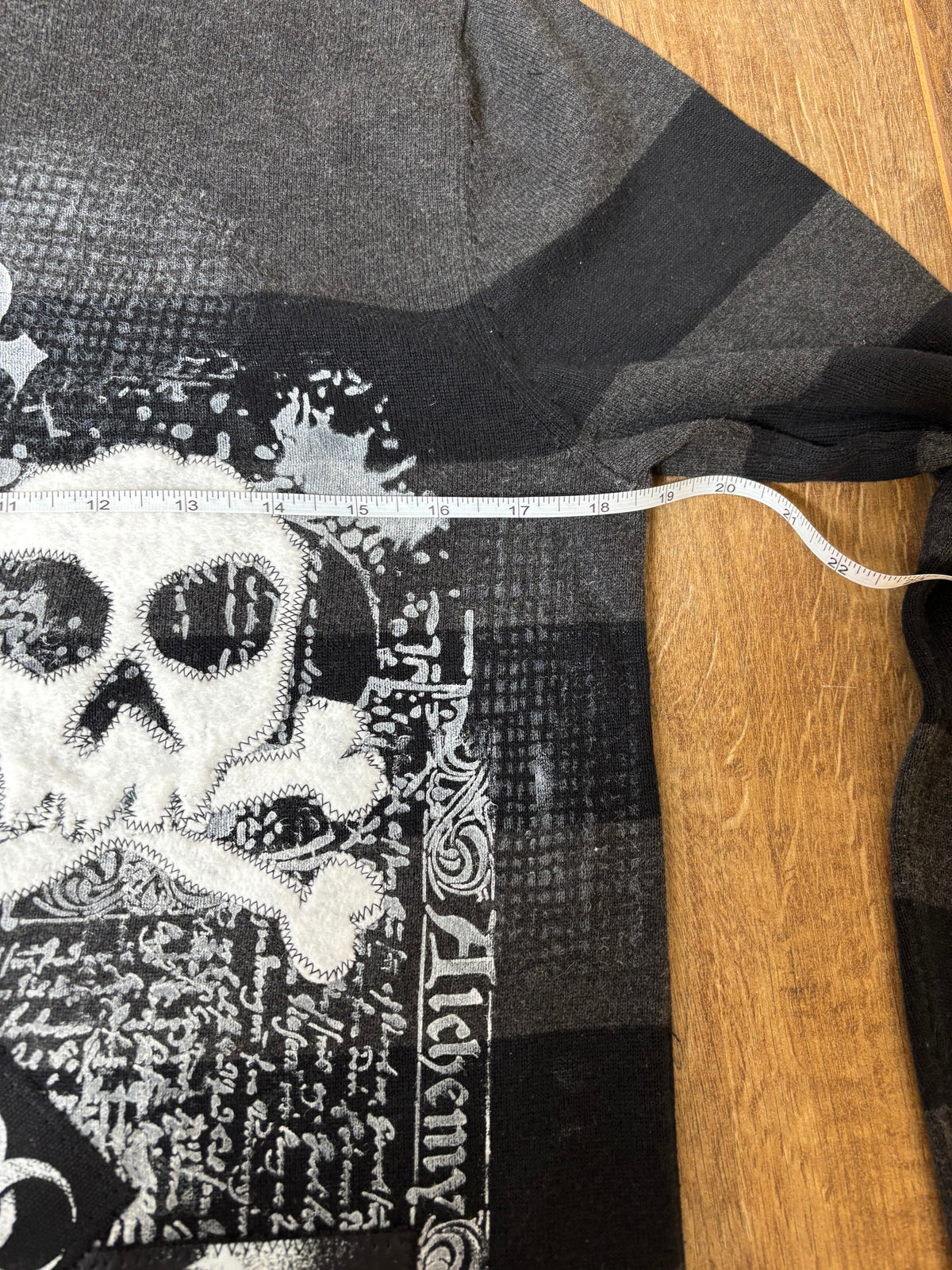 Black and gray striped sweater jumper upcycled with creepypasta patches and skulls