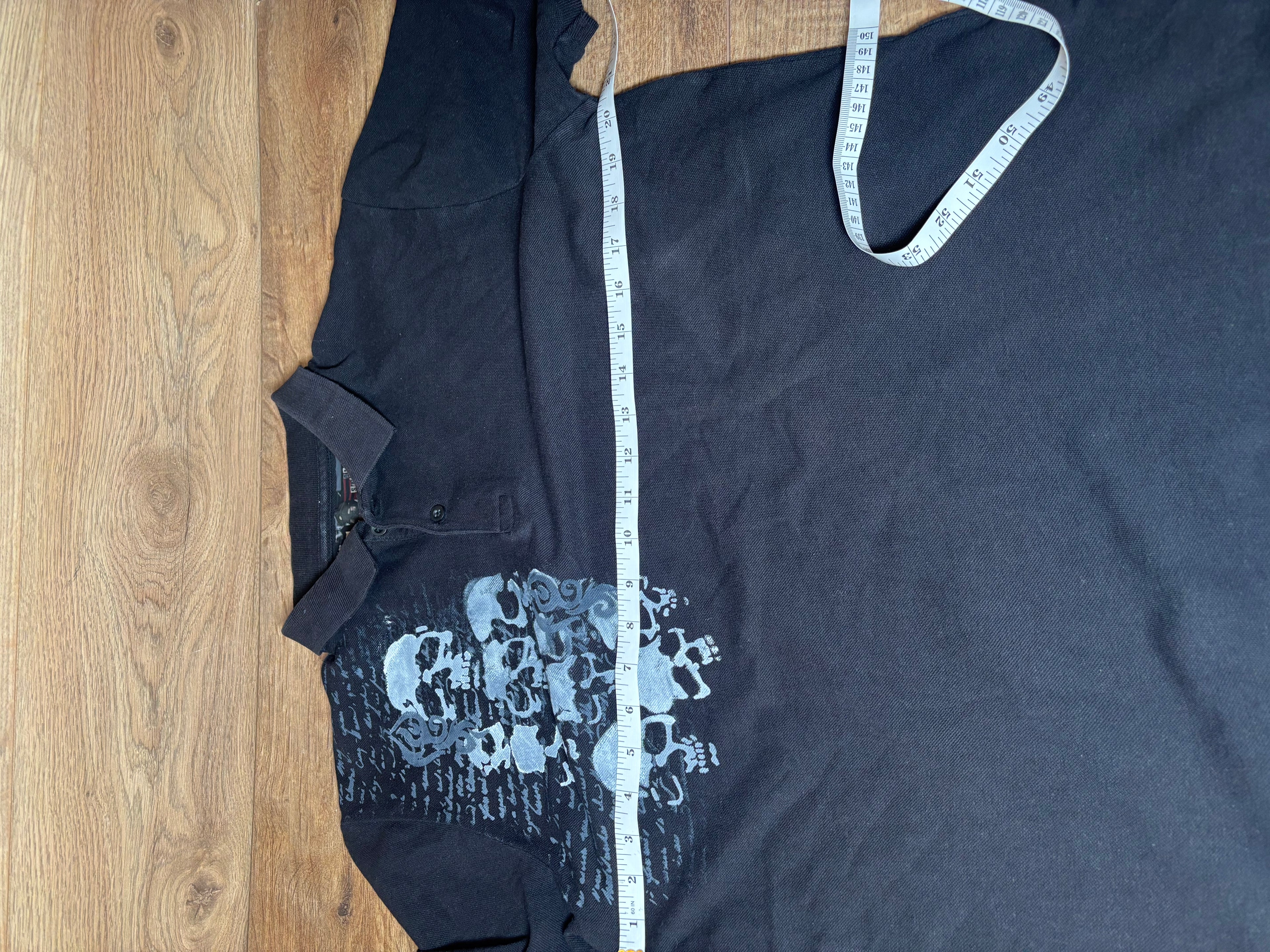 Skater style black and gray printed skull polo
