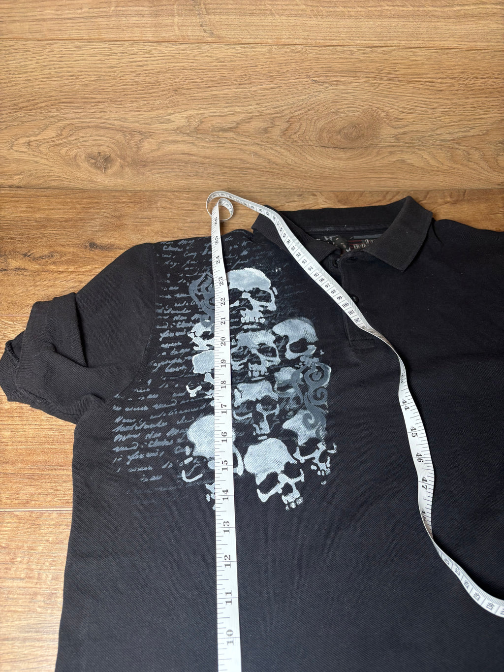Skater style black and gray printed skull polo
