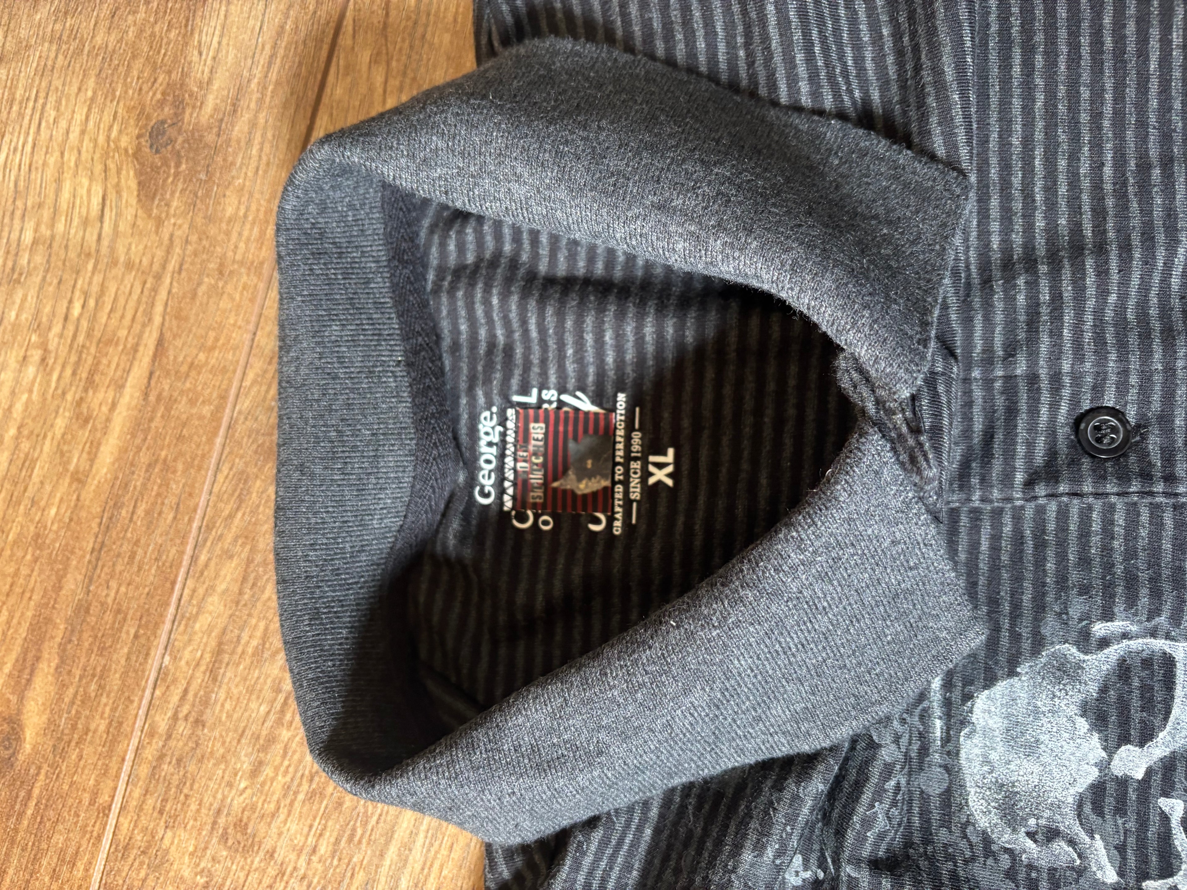 Skater style black and gray striped printed skull polo