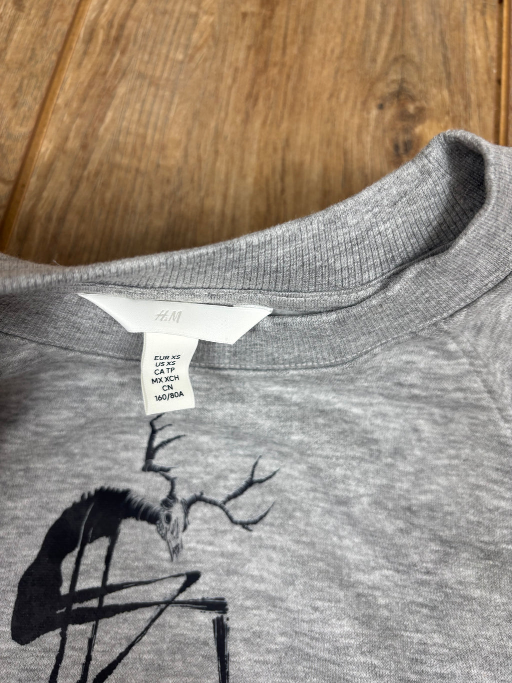 Upcycled gray jumper wendigo cryptid horror